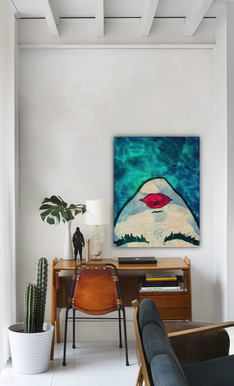 a chic home office nook by the window accented with a leather chair and a bold artwork