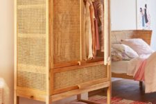 19 a vintage-inspired wood lettice cabinet is ideal as a wardrobe for a summer home