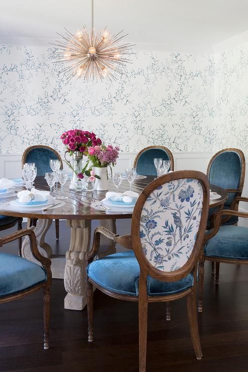 refined vintage chairs with blue velvet seats and floral printed fabric on the backs to match the wallpaper