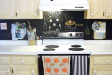 20 an ivory kitchen with white countertops and a chalkboard backsplash for a contrasting look