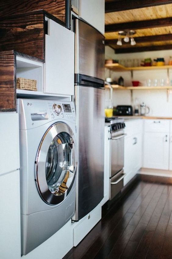a washer and dryer combo unit built in under the stairs to save some space