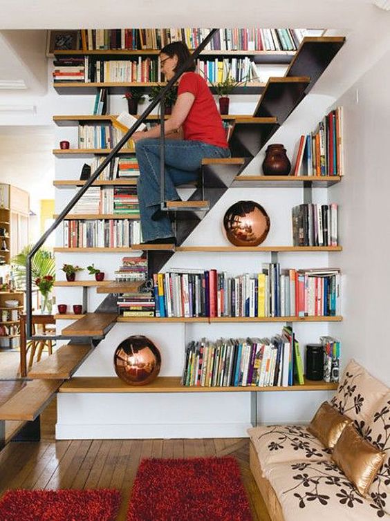 bookshelves built in into the staircase itself - use the steps for sitting there