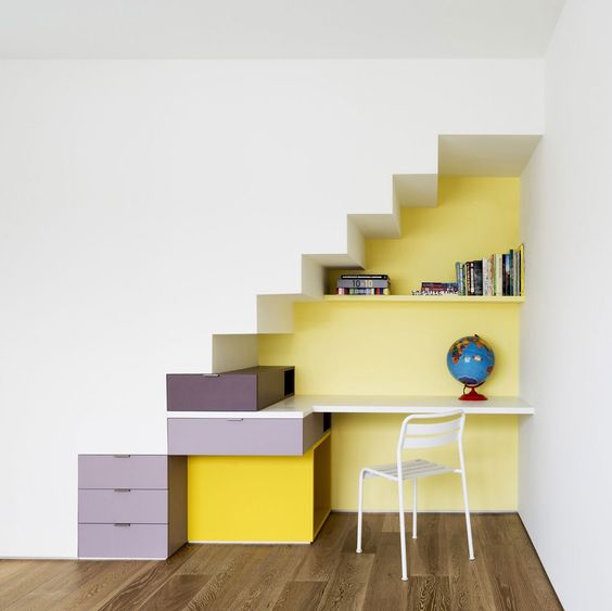 colorful storage pieces attached to the walls serve as a staircase at the same time