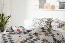 23 printed bedding in white, grey and red for a touch of print and color to the room