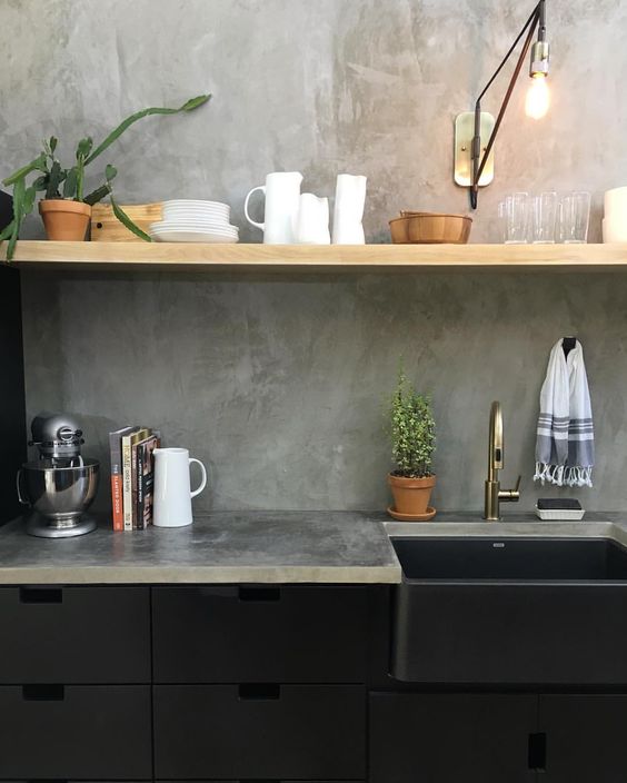 black metal cabinets, an open shelf and a concrete backsplash and countertops for an industrial look