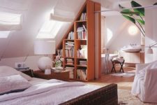 24 divide the spaces with a large triangle-shaped bookshelf that perfectly fits the attic roof