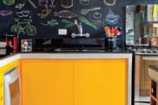 25 turn your chalkboard backsplash into your own artwork chalking various food and drinks on it