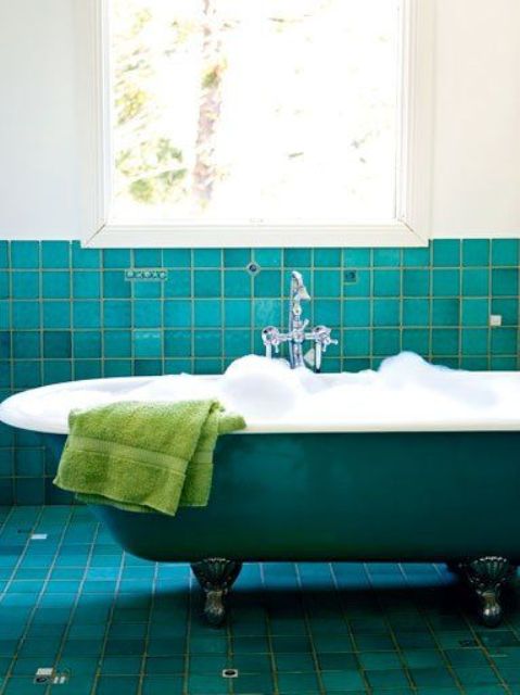 turquoise tiles and a matching bathtub for a bold vintage-inspired space
