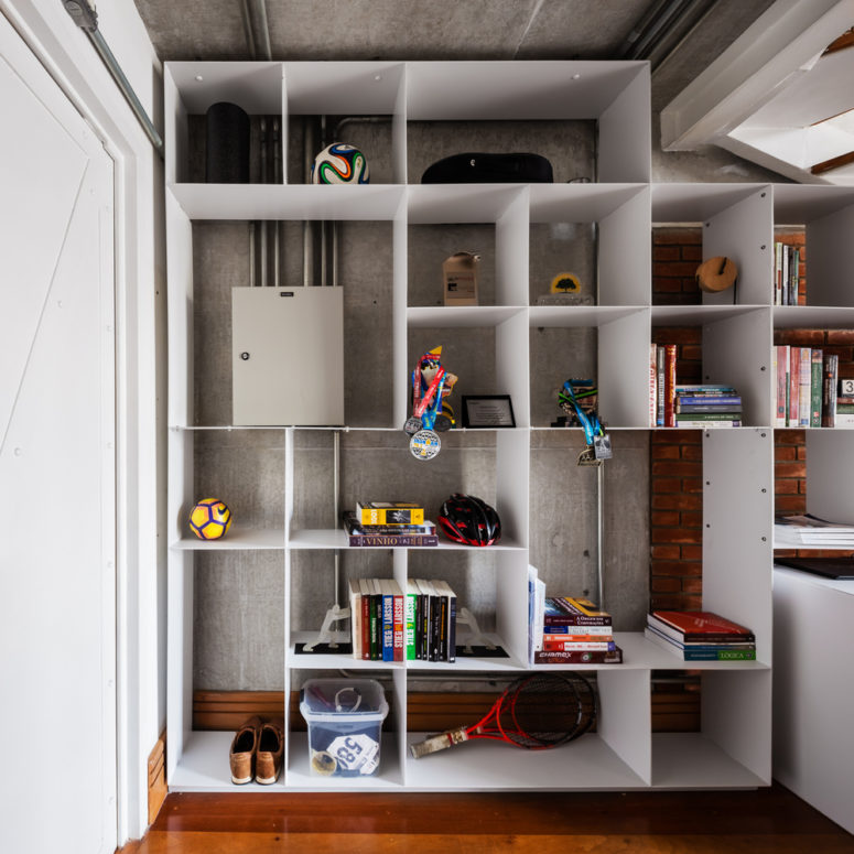 Here's a customized shelving unit with much storage space, it was designed to be built in the space