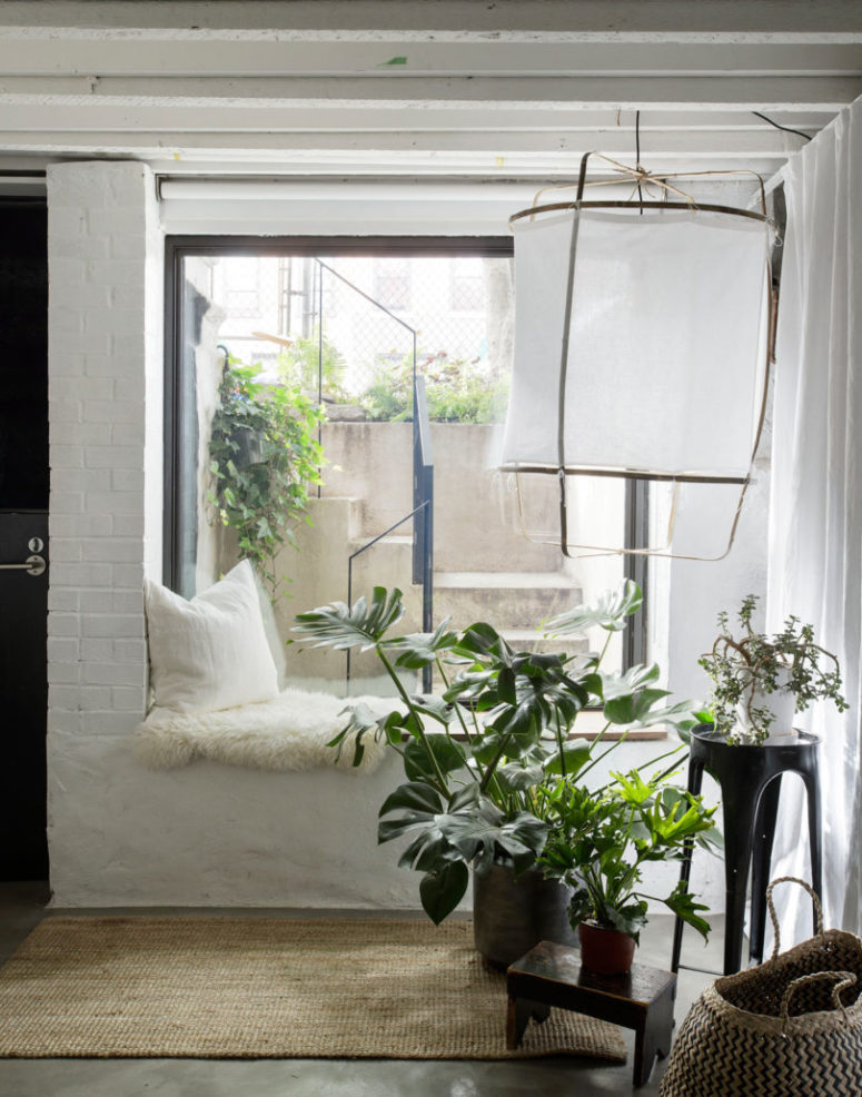 The interior decor is done in Scandinavian style, with lots of white and some wood and wicker touches
