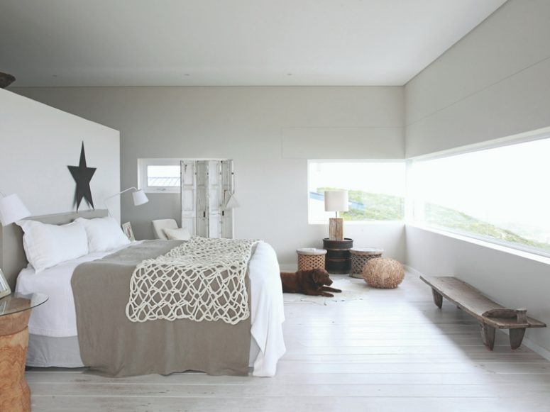 The master bedroom is done in white and light grey, with a cool long window, soft textiles and wood and wicker for a ship feel The master bedroom is done in white and light grey, with a cool long window, soft textiles and wood and wicker for a ship feel