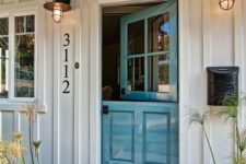 02 a beach cottage entrance with a beautiful blue Dutch door and cute lamps