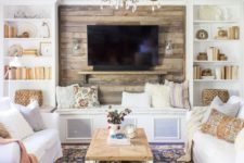 02 a bright eclectic space with rustic touches and two white sofa accessorized with pastel pillows