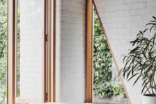 03 There’s a large window and a couple of triangle cutouts for connecting the space to outdoors and fill it with natural light