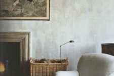 03 a neutral cozy space with greyish plaster walls that add more texture to the space
