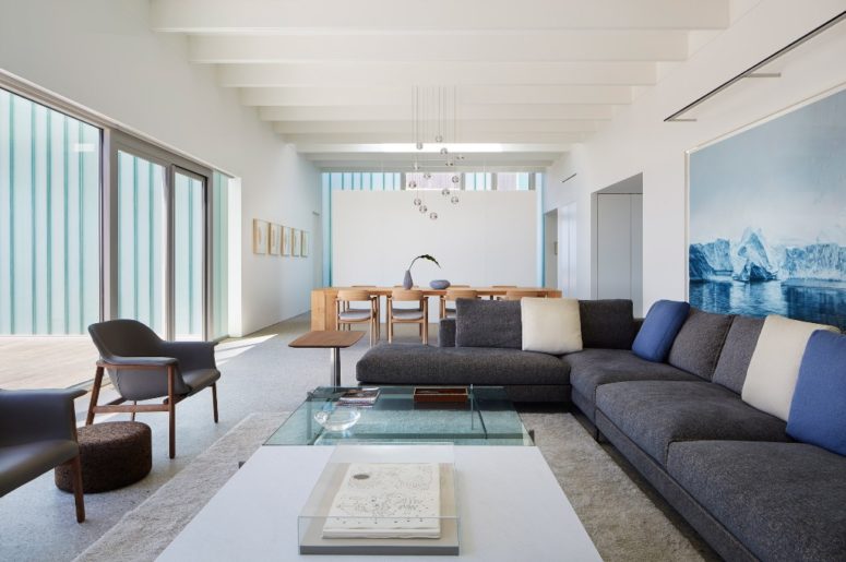 The open plan space is a combo of a living and dining space, there's a creative bubble chandelier and the space feels airy The open plan space is a combo of a living and dining space, there's a creative bubble chandelier and the space feels airy