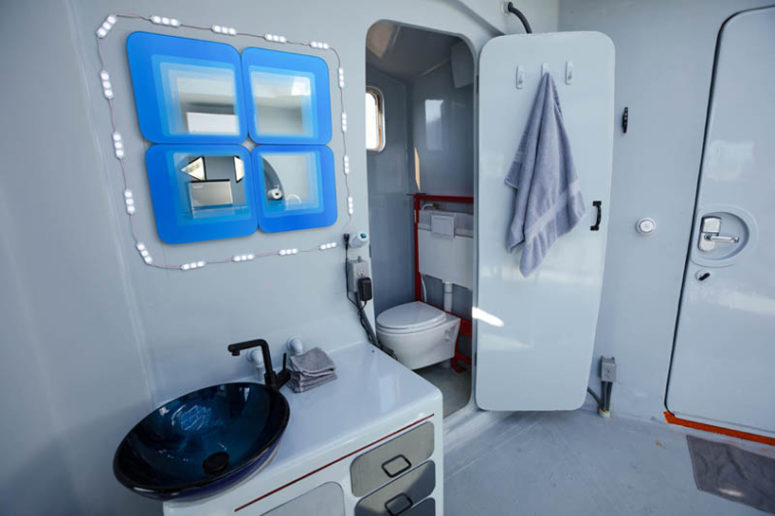 super tiny but functional bathroom There's a tiny bathroom with everything necessary and the towels can be hung on the doors
