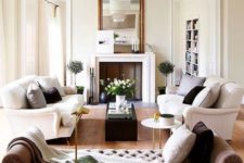 05 a refined living room with two white sofas and a tufted daybed for a luxurious feel
