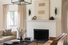 05 an elegant living room done in the sahdes of beige and camel plus black details for depth