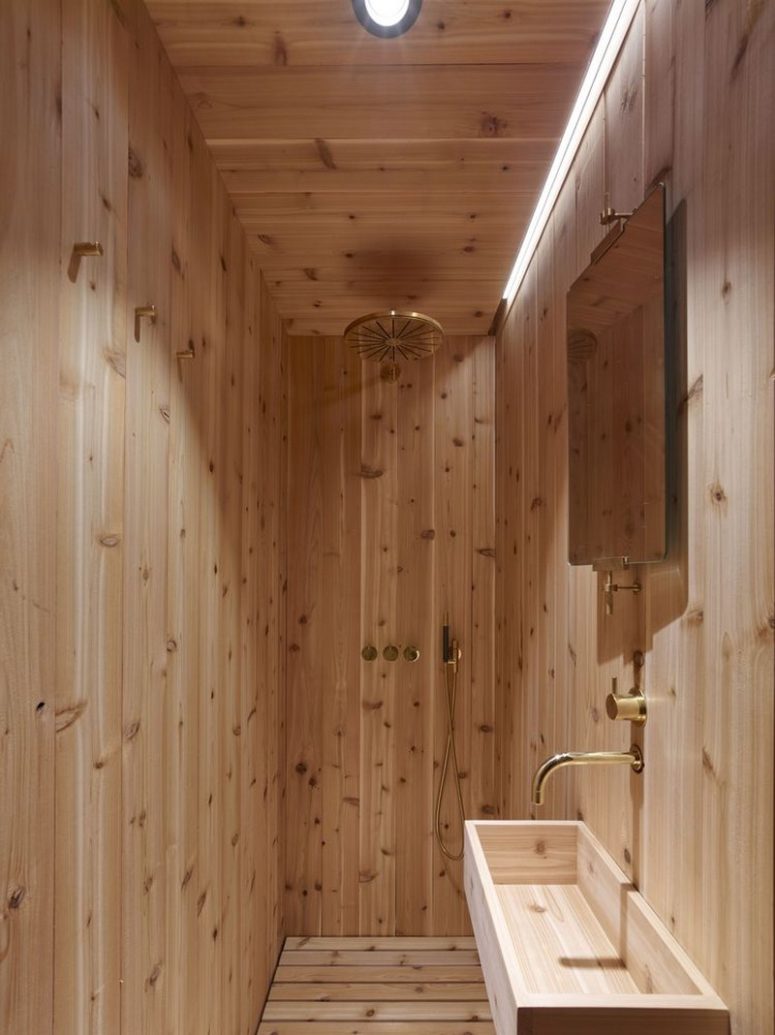 stylish all wood bathroom design The bathroom is small, it features a shower and a sink, everything here is clad with wood
