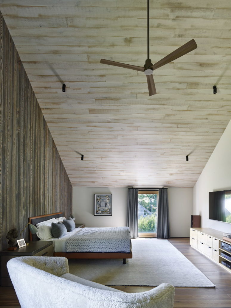The master bedroom is an attic space with a comfy bed, loveseat, some modern furniture and a large glass door to enter the garden The master bedroom is an attic space with a comfy bed, loveseat, some modern furniture and a large glass door to enter the garden