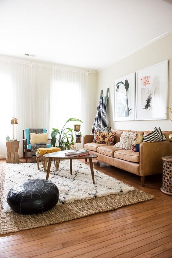 a camel floor and leather sofa warm up this boho living room