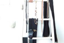 07 a ladder can be also used as a storage piece for various types of accessories