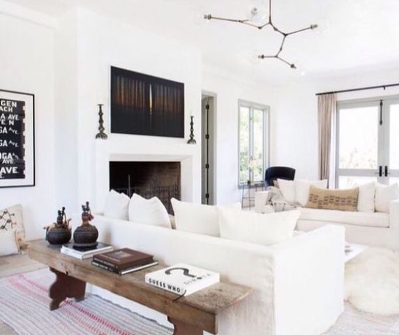a serene and fresh space done in white with touches of black for a contrast and depth