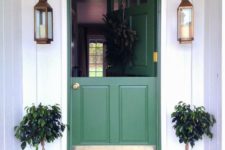 08 a chic green Dutch entrance door with brass touches, lanterns and pots for a cute look
