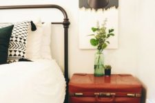 11 a vintage suitcase placed on trendy hairpin legs gives a cool boho chic nightstand