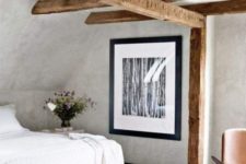 11 off-white plaster walls and a ceiling plus wooden beams bring a vintage feel and modern furniture for an edgy touch