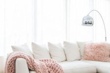 12 an all-white living room is injected with blush pink accessories and touches of metallics