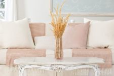 13 a chic living room with touches of blush and powder blue for a touch of color