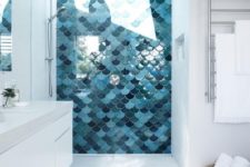 14 the shower done with fish scale tiles and a skylight makes showers a spa experience while keeping them private