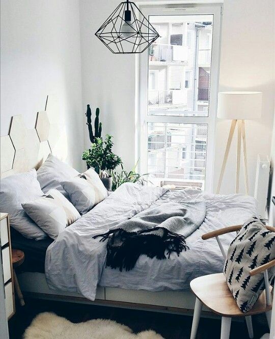a single hanging lamp over the bed is enough to illuminate this small space