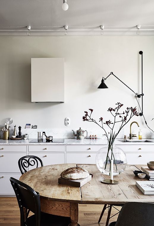 white plaster walls and white marble for a stylish modern space and black touches for depth