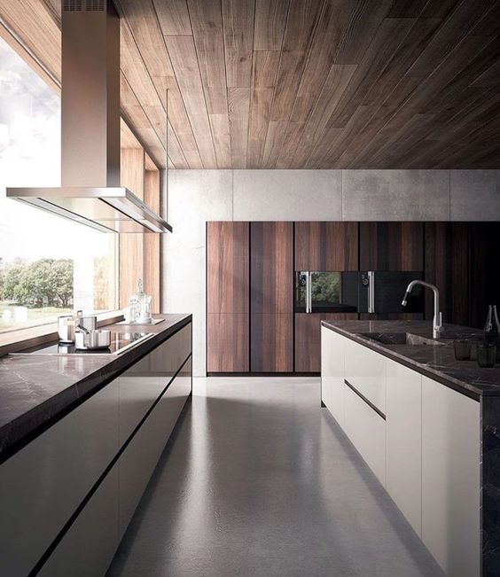a contemporary kitchen in white and rich-colored wood with a window as a backsplash