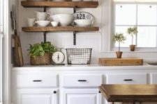 19 thick open shelves and dinnerware makes the kitchen look more cluttered
