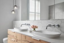 22 a white bathroom with a minimalist wooden vanity plus white sinks