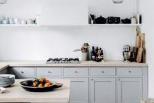 23 a white plaster wall and backsplash plus light grey cabinets for a serene kitchen look