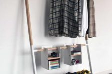 24 a functional modern makeshift closet with a drawer for smaller stuff and some hanging open boxes for accessories