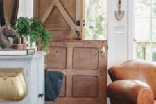 24 a rustic stained wooden door with no glass adds to the rustic living room