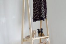 25 a light-colored wooden rack for clothes and step shelves for shoes can be handmade