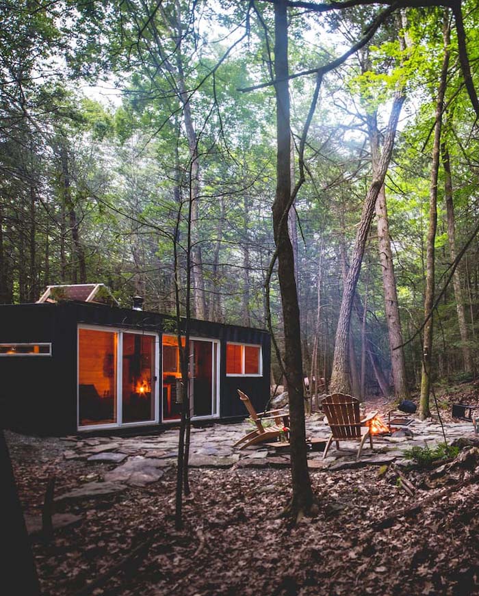This small forest cabin is made of a shipping container and features everything necessary for a nice rest This small forest cabin is made of a shipping container and features everything necessary for a nice rest