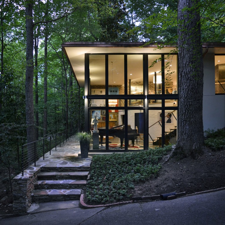 The house features much glazing, which allows enjoying the forest views and enough light that comes through the branches The house features much glazing, which allows enjoying the forest views and enough light that comes through the branches