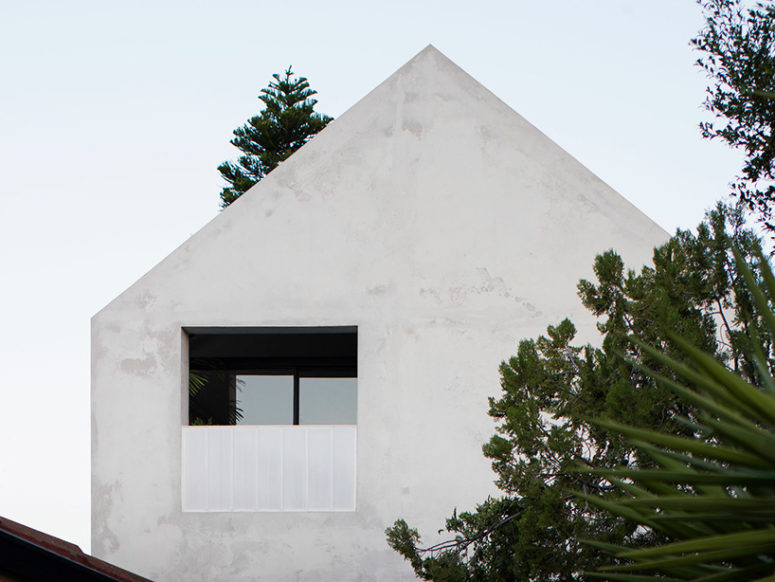 The house is covered with concrete and plaster, which is in harmony with what you'll  see inside it