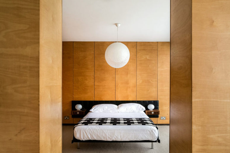 The master bedroom is clad with light colored plywood, there's a comfy bed and a couple of wardrobes The master bedroom is clad with light-colored plywood, there's a comfy bed and a couple of wardrobes
