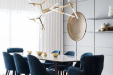 02 a geometric grey panel statement wall in the dining room looks cool and very contemporary