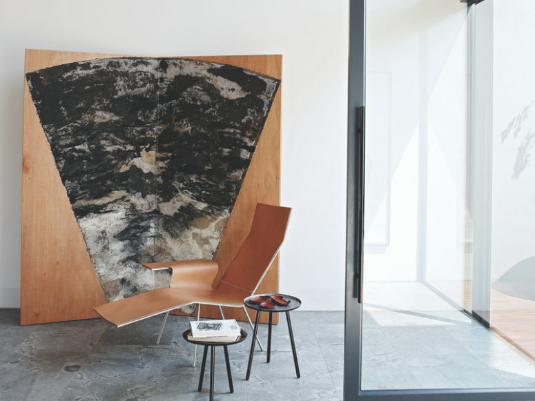 Interesting artworks and creative furniture make the spaces bold and negative space lets the house breathe