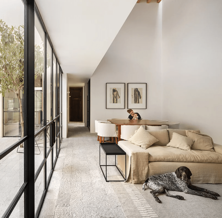 The interiors are done in light shades, the furniture is neutral, too, and there are glazed walls toenjoy natural light The interiors are done in light shades, the furniture is neutral, too, and there are glazed walls toenjoy natural light
